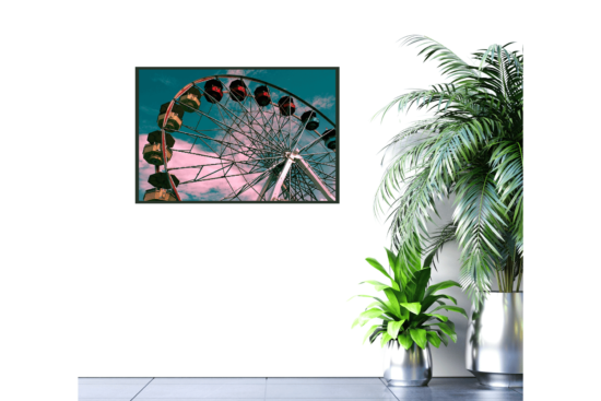 Ferris wheel with turquoise sky picture hanging on a wall