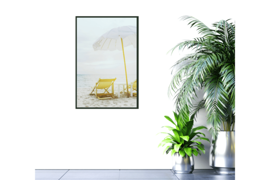 yellow beach chair, white umbrella at beach picture on wall