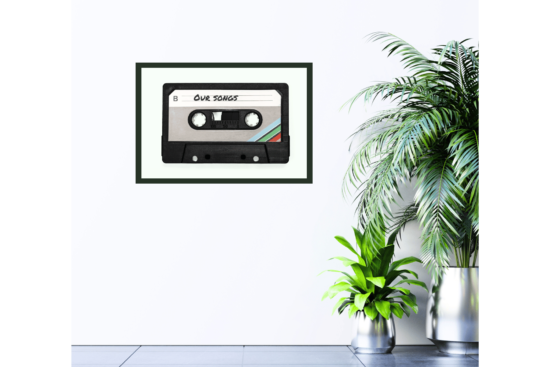 old cassette tape with "Our Songs" written on it, green background, print hanging on wall