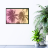 Palm trees with pink, orange, and yellow overlay print hanging on wall