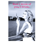 Black and white photo of woman standing by water with wine glass in hand and "When I think of you, I drink" phrase in red font wall print