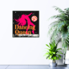 Dancing Queen orange text with outline of girl dancing in red and multi-color disco ball picture hanging on wall