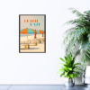 Beach Daze text with beach chairs and blue and orange umbrellas picture hanging on wall