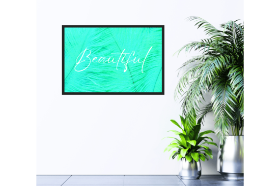 Beautiful text in white with green feather background picture hanging on wall