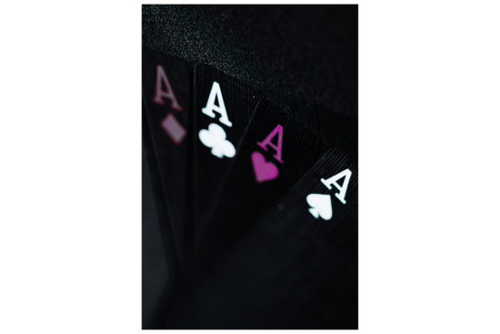 Four Ace cards in purple, gray, and black wall print
