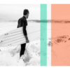 Black and white of surfer on beach holding surfboard with orange and teal stripe overlays wall print
