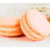 Two peach macaroons with green tea towel in background wall print
