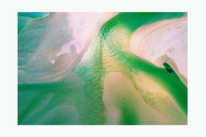 Green ocean with beach from above creating an abstract view wall print