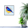 Yellow, blue, purple, and red bird with blue and gold background print hanging on wall